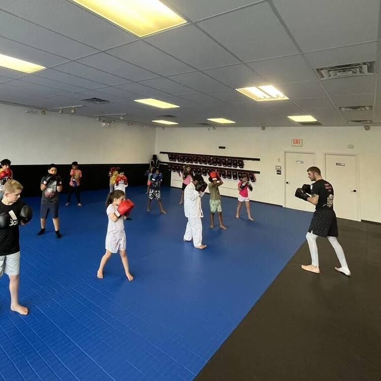 kids in a BJJ class stand in the striking position at our gym in Wilkes Barre Pennsylvania